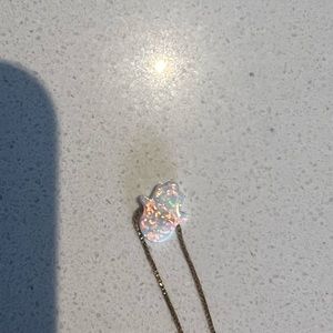 Gold chain and white hamsa necklace